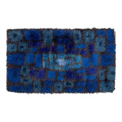 Sweden, blue-toned rya carpet with geometric pattern. Modernist design.
