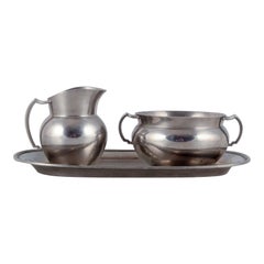 Vintage Just Andersen, creamer and sugar bowl on tray in pewter. 940s. 