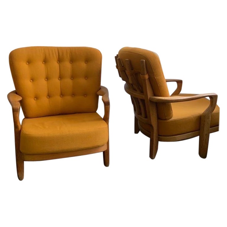 Pair of guillerme et chambron oak armchairs 