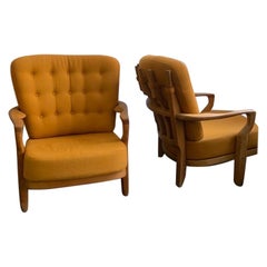 Pair of guillerme et chambron oak armchairs 