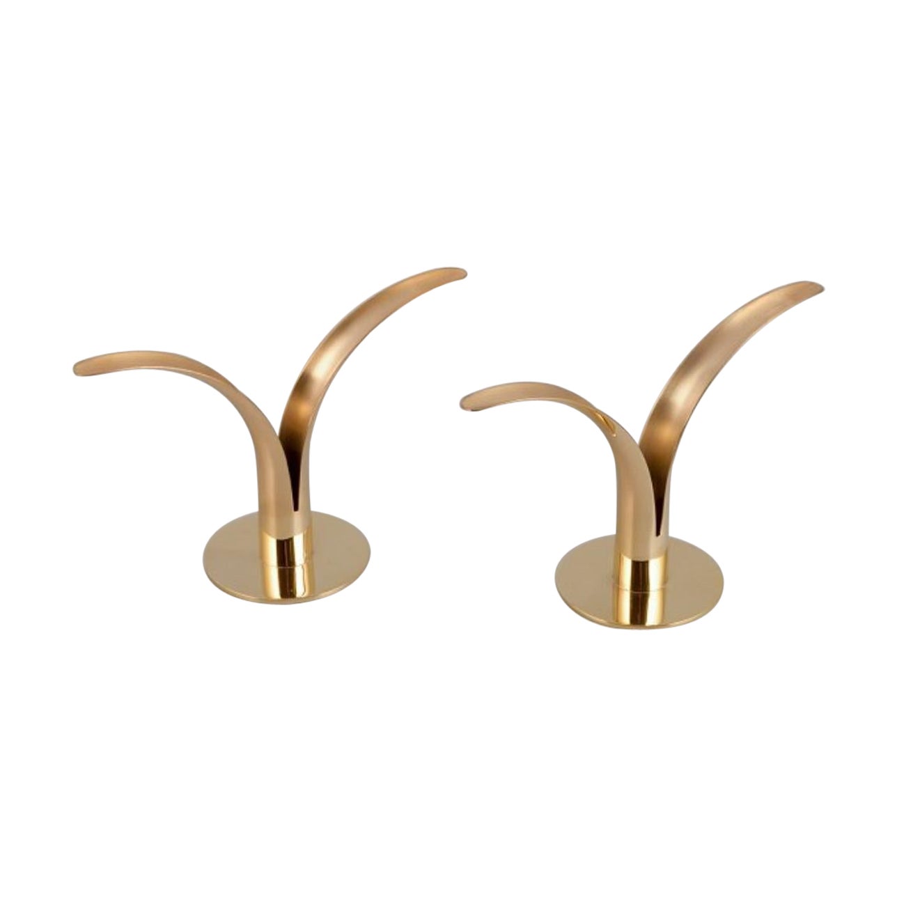Skultuna, pair of "Liljan" (Lilly) candle holders in brass. 21st C. For Sale