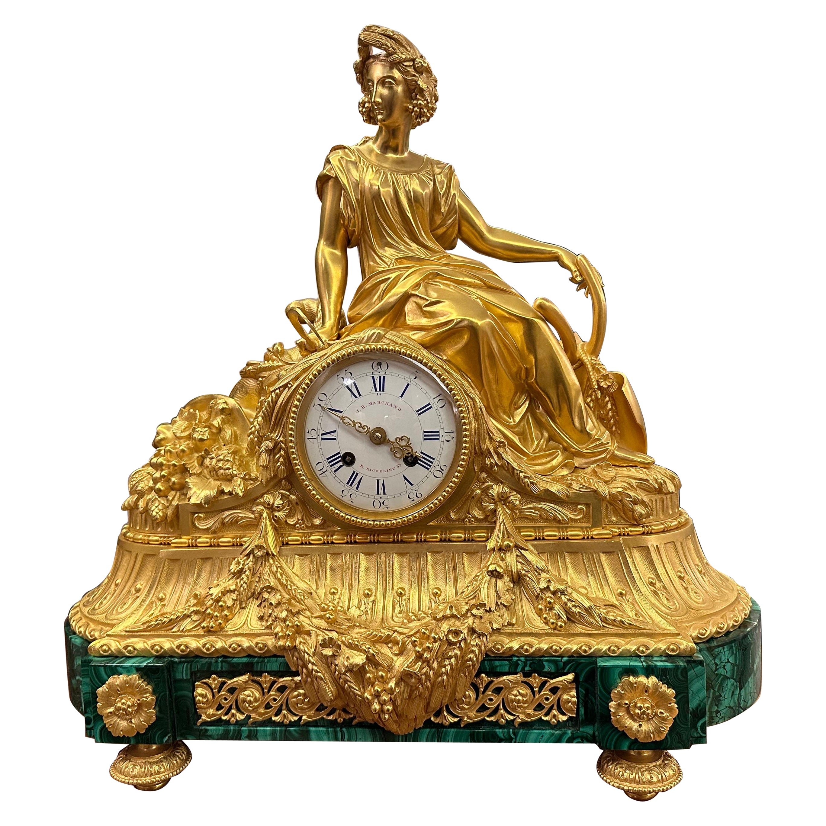 A beautiful clock from the time of Napoleon III in gilded bronze and a uniquely colored malachite base.

Details of the movement mechanism: Eight days there is a pendulum hanging. He struck an hour and a half on the bell. The clock is working great