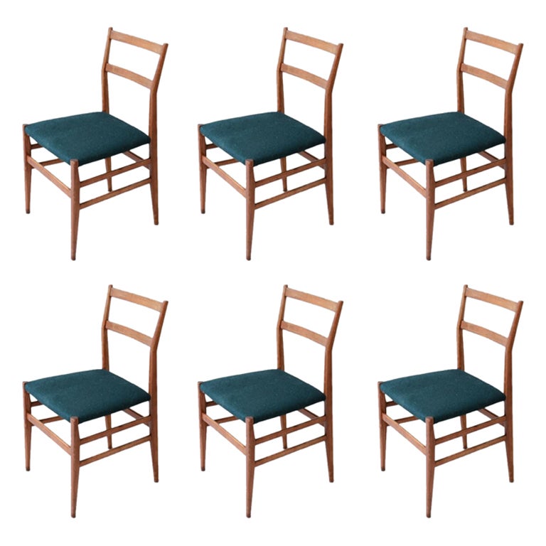 Gio Ponti set of 6 chairs in wood with fabric covering.