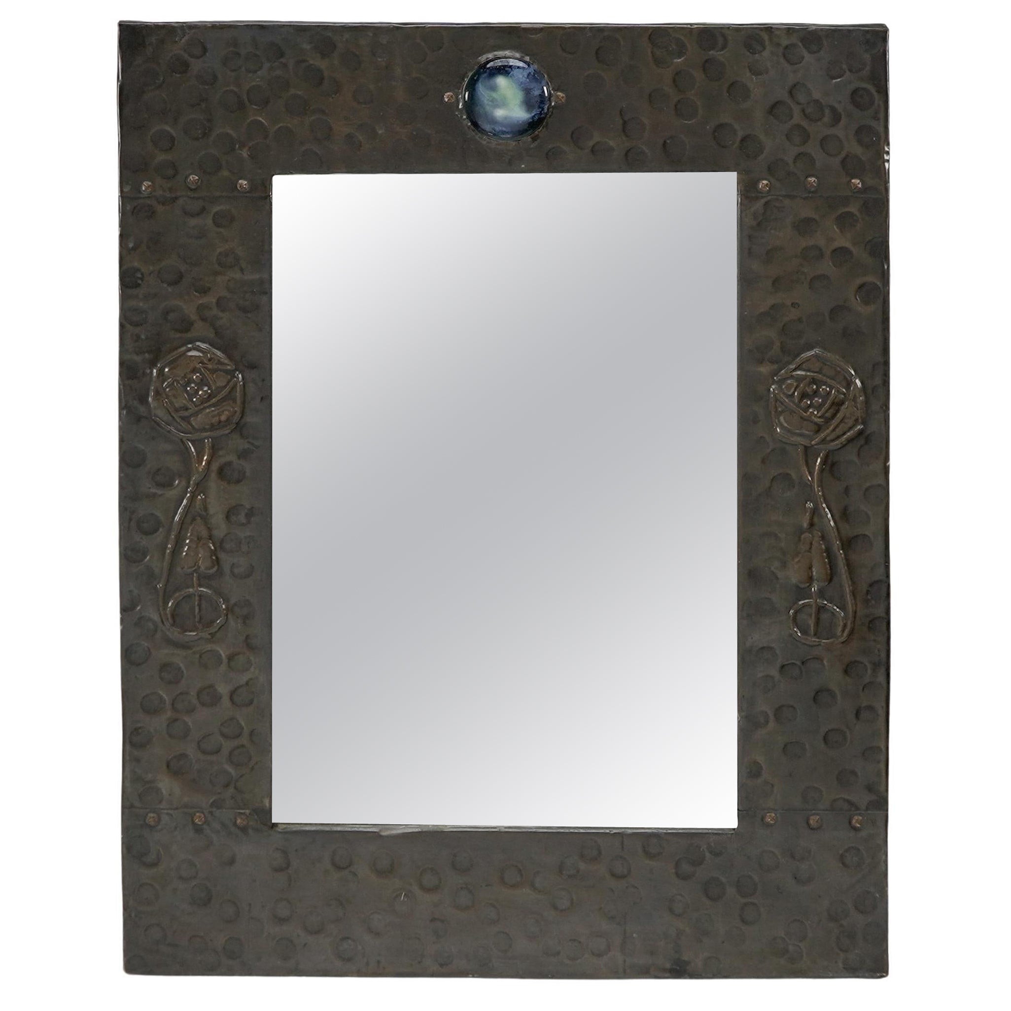 Liberty and Co. An Arts and Crafts copper mirror with a cloudy blue Ruskin Jewel For Sale