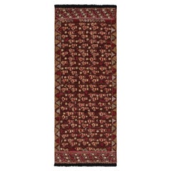 Tapis de course de style tribal à motifs géométriques rouges et dorés de Rug & Kilim