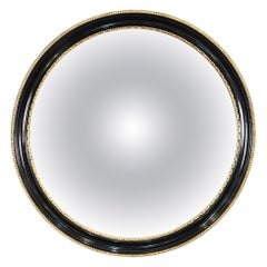 Miroir convexe anglais rond en ébène encadré noir et or (diamètre 18 1/2)