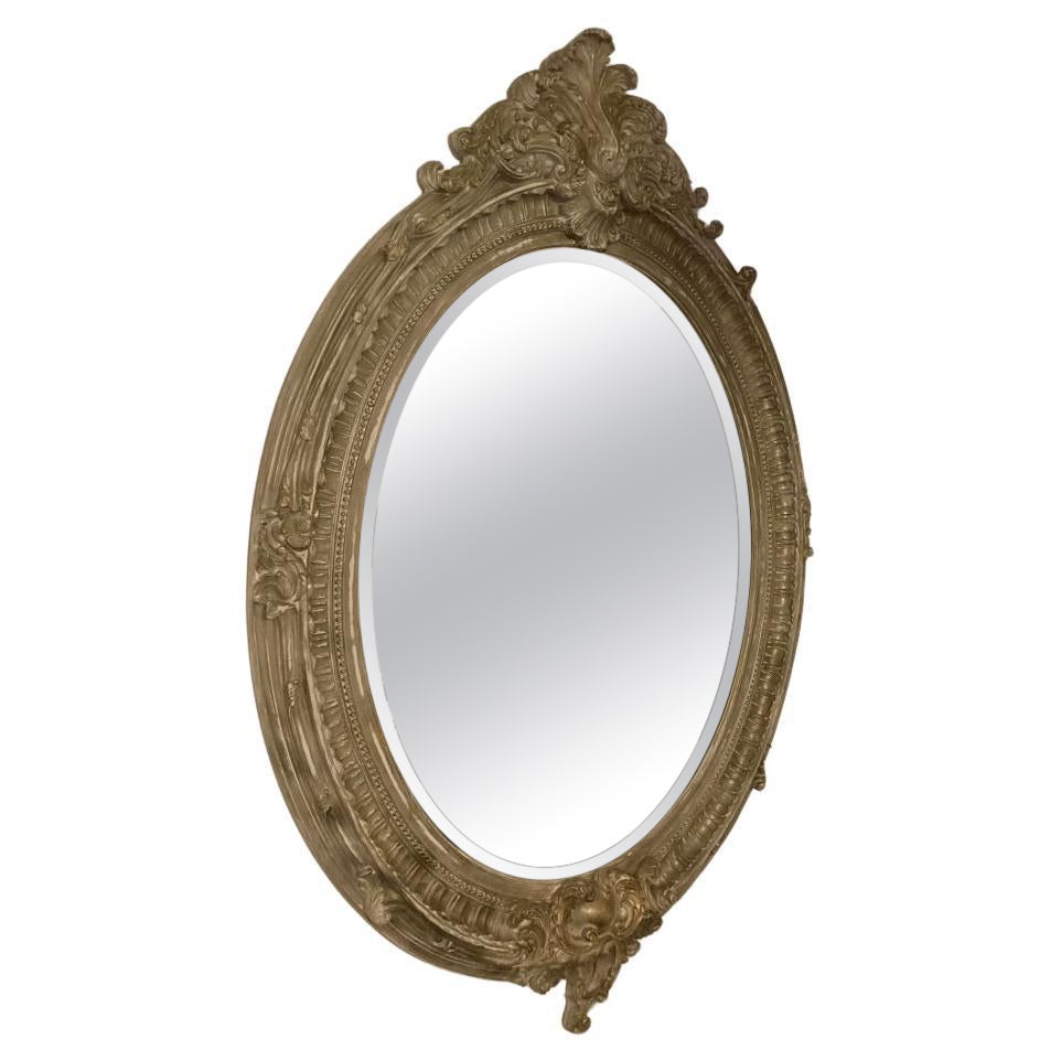 A large modern but antique looking French Rococo Style wall Mirror