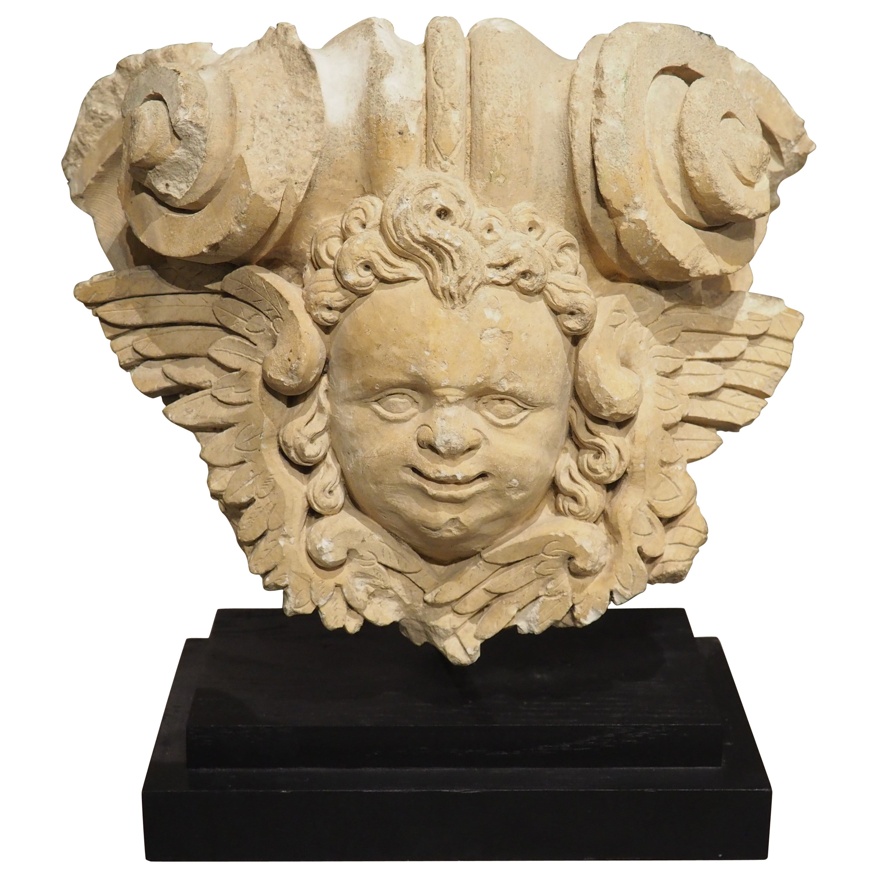 A 17th Century Mounted French Limestone Carving of a Winged Angel For Sale