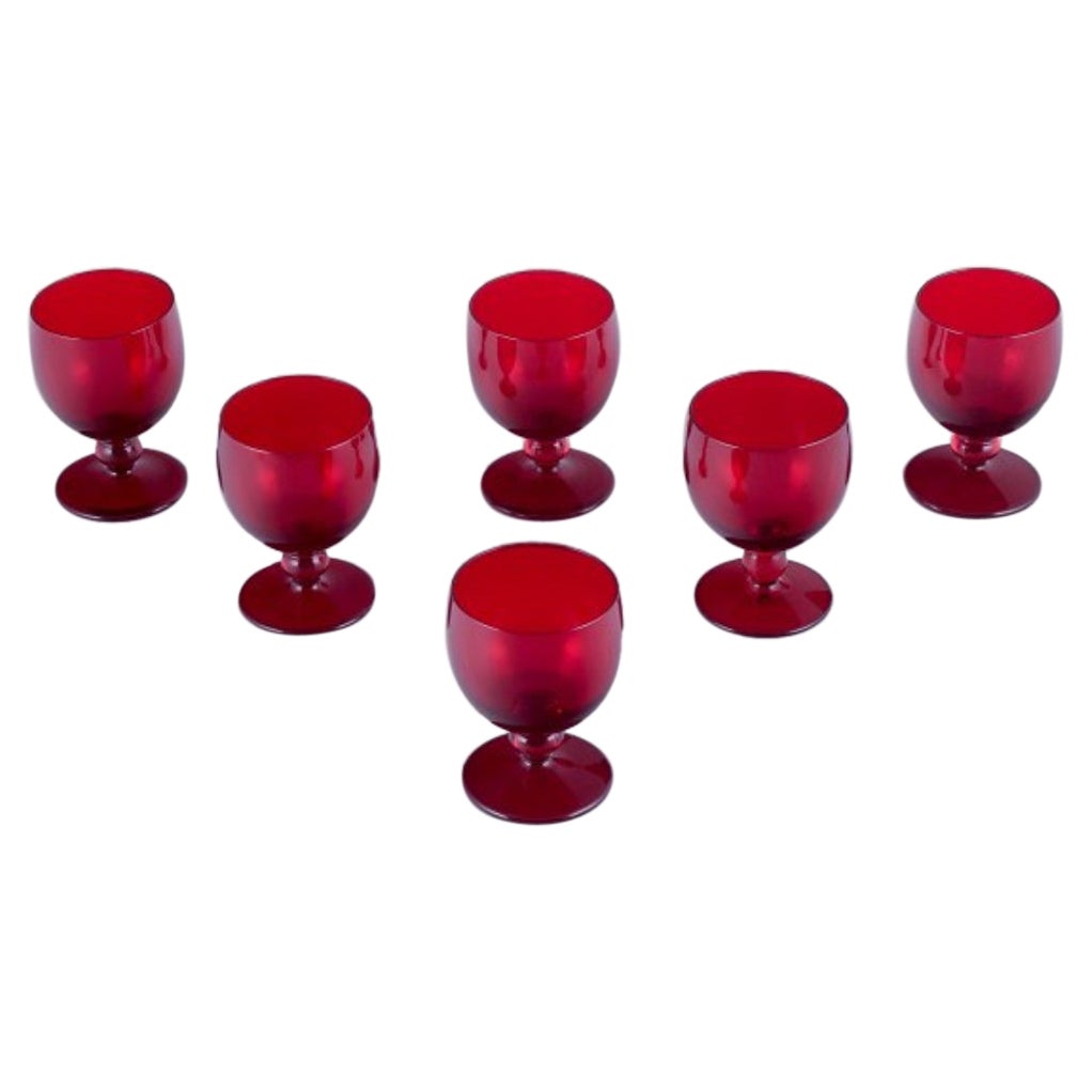Monica Bratt for Reijmyre. Set of six small wine glasses in red art glass