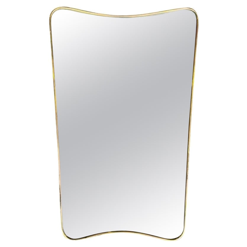 An orignal Italian 1950s brass shield mirror attributed to Gio Ponti