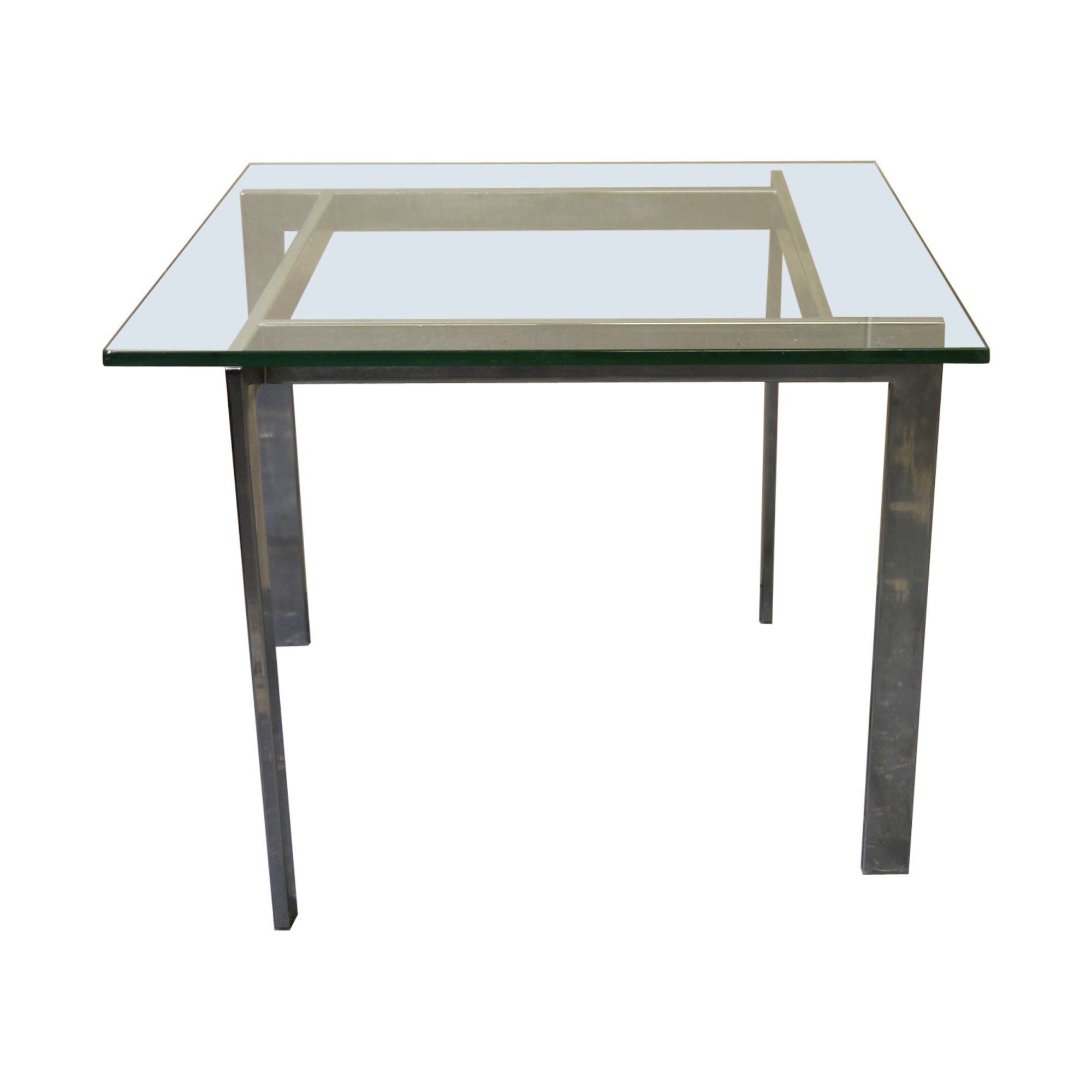 Chrome and glass side table in the manner of Milo Baughman For Sale