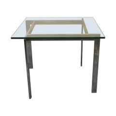 Chrome and glass side table in the manner of Milo Baughman