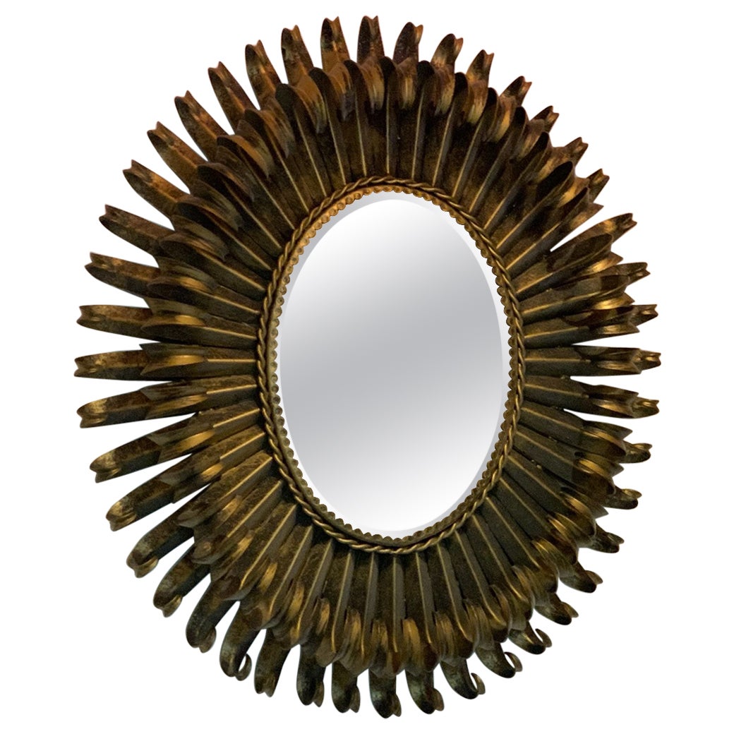 French gilded starburst iron mirror, mid-1900s.  For Sale