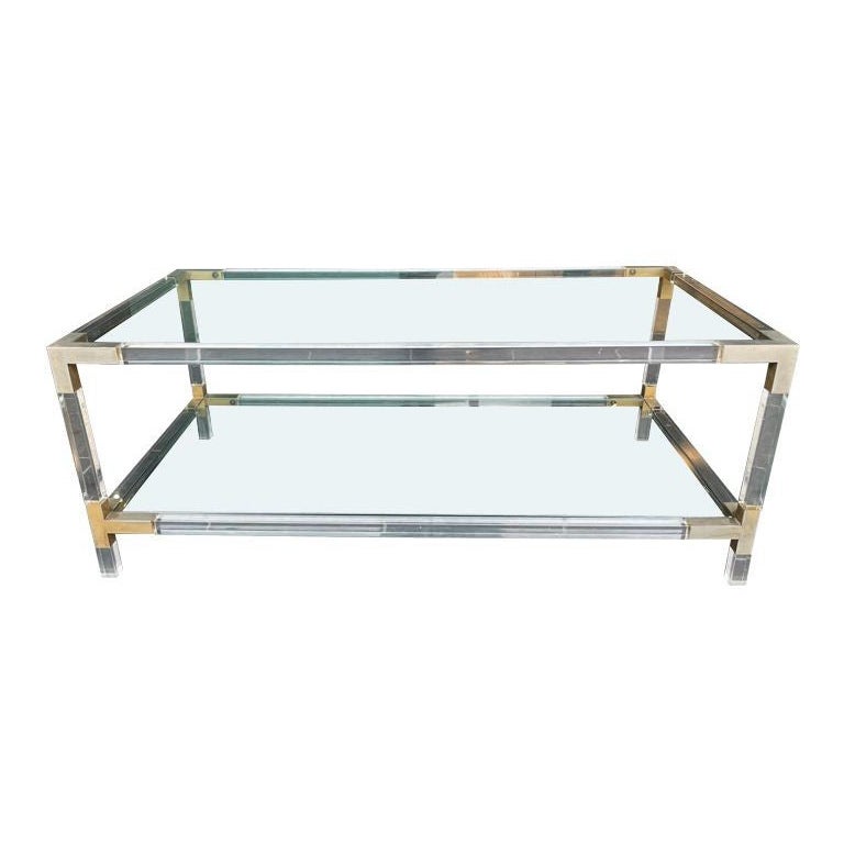 A French 1970s lucite and brass two tiered coffee table with glass plates For Sale