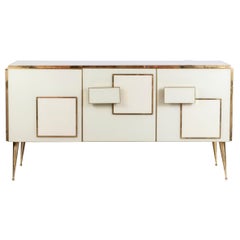 Geometric sideboard in glass and gilded brass. Contemporary Italian work.