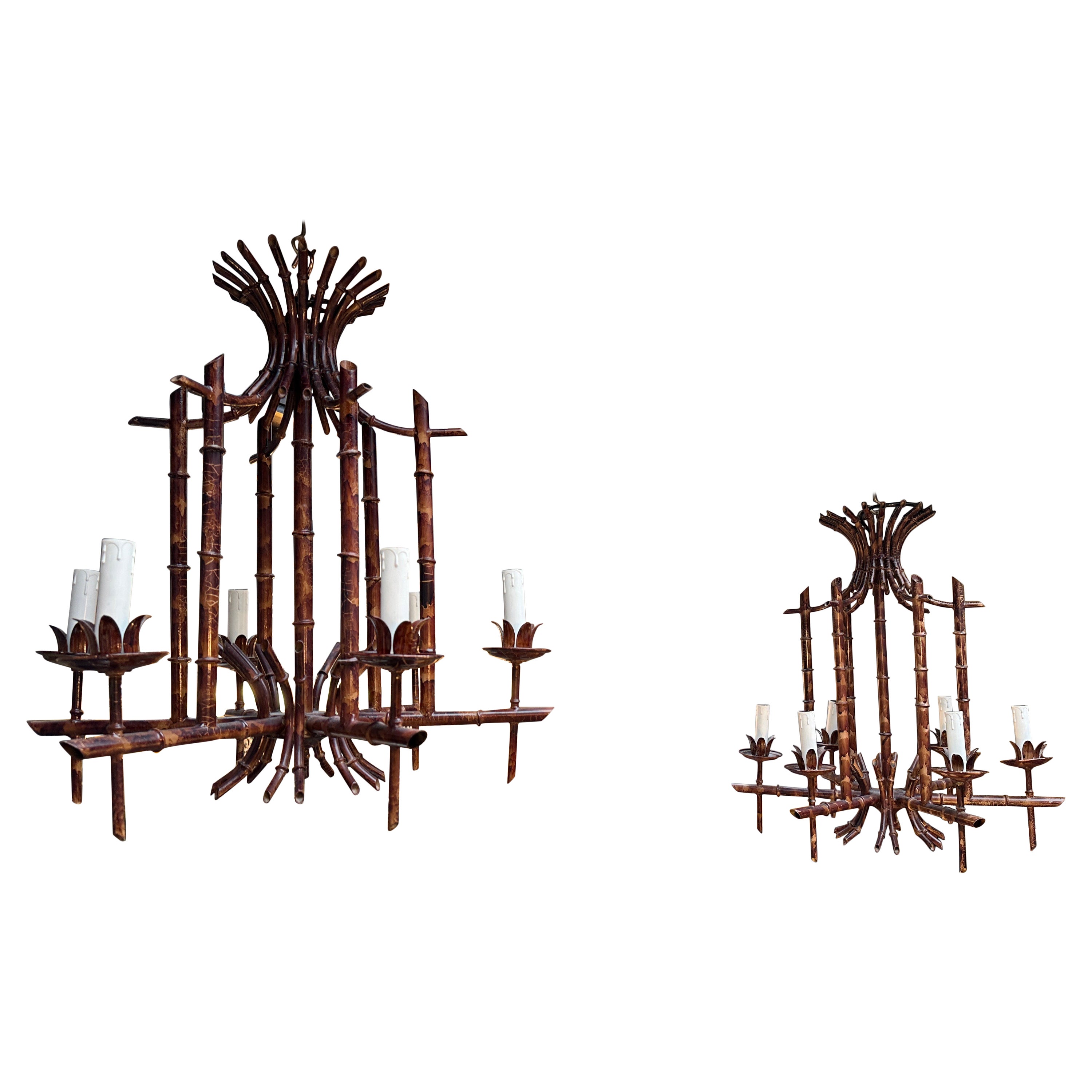 A pair of Patinated metal Italian faux bamboo style 6 arm chandeliers. Chinoiserie style lighting with coloured patinated frames, white candle holders. Very decorative and unusual 