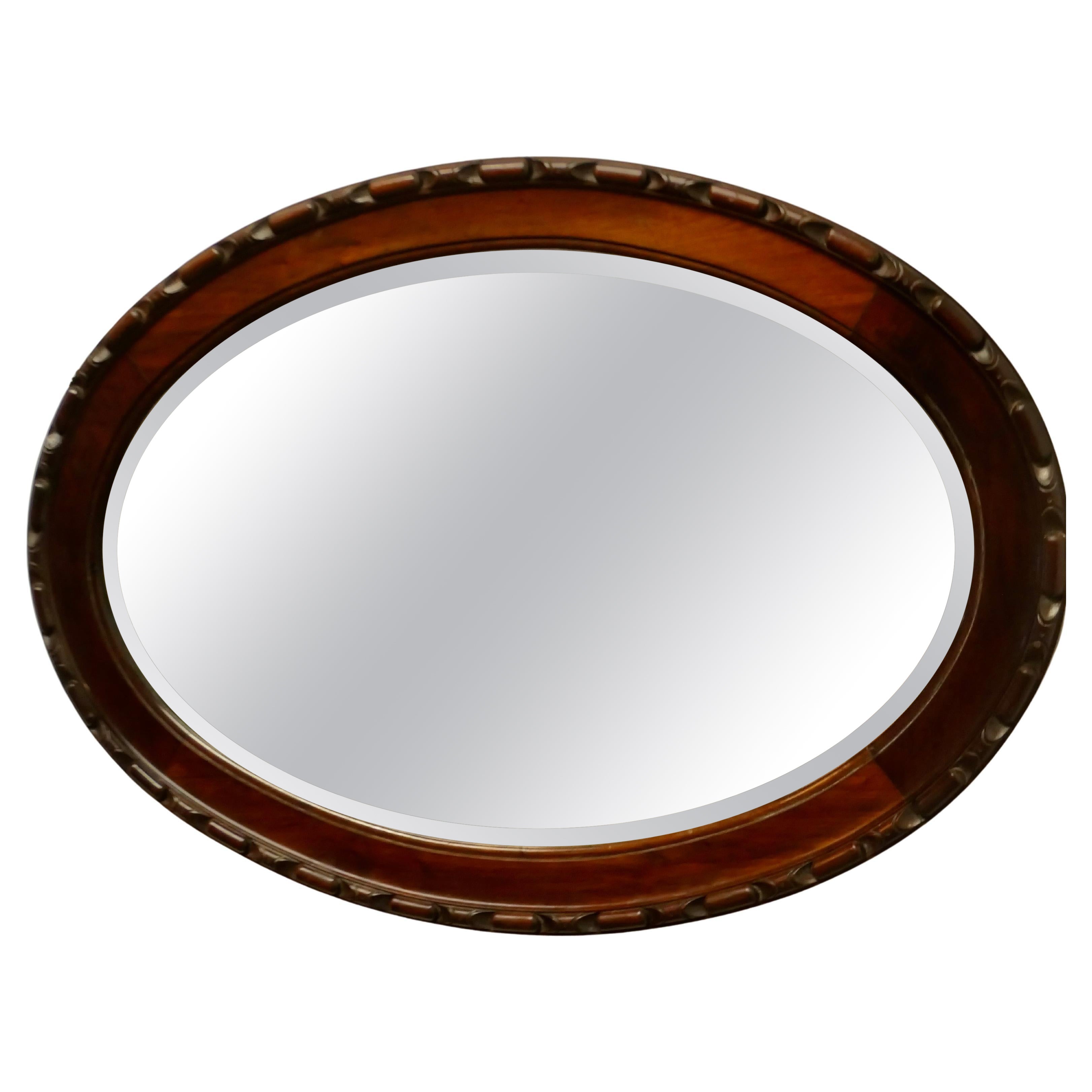 Large Edwardian Carved Walnut Oval Mirror    For Sale