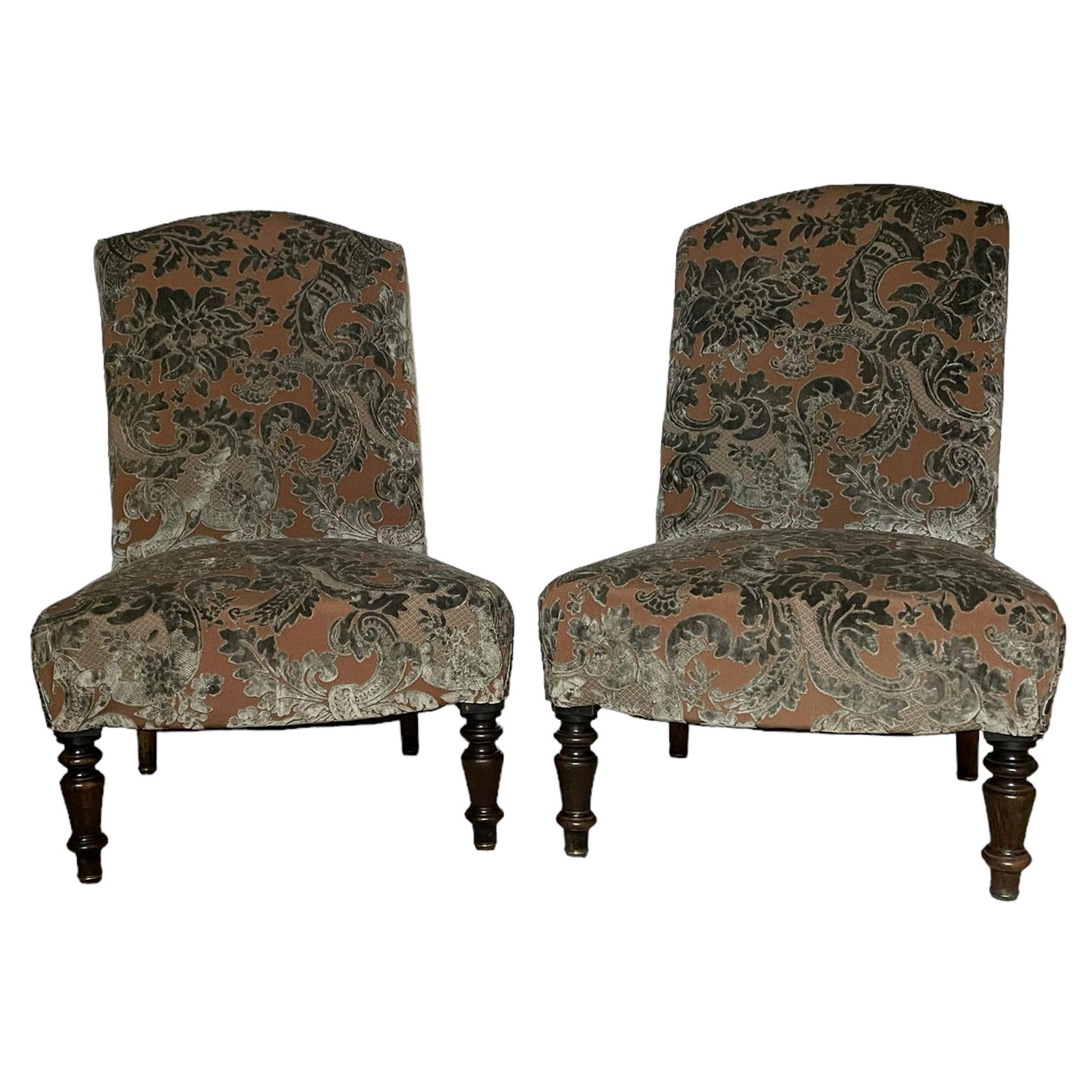 French pair of Napoleon III slipper chairs

A fabulous pair of low back upholstered side chairs, nicely wide seated design with beautifully polished ebonized legs.
Fully reupholstered in this relief fabric
seat depth 18 inches.

Sprung seats so very