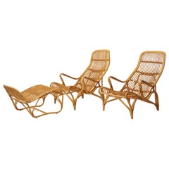 Retro Swedish Modern Bruno Mathsson Pair of Rattan Lounge Chairs and Footstool