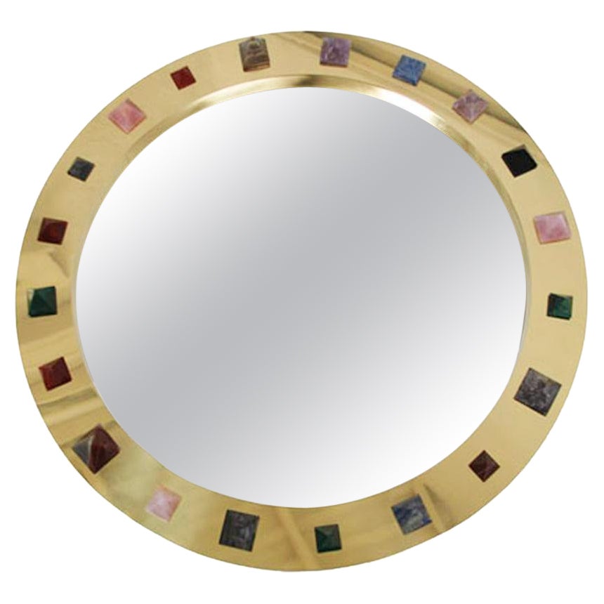 Specchio circolare moderno con cornice in ottone e pietra semipreziosa