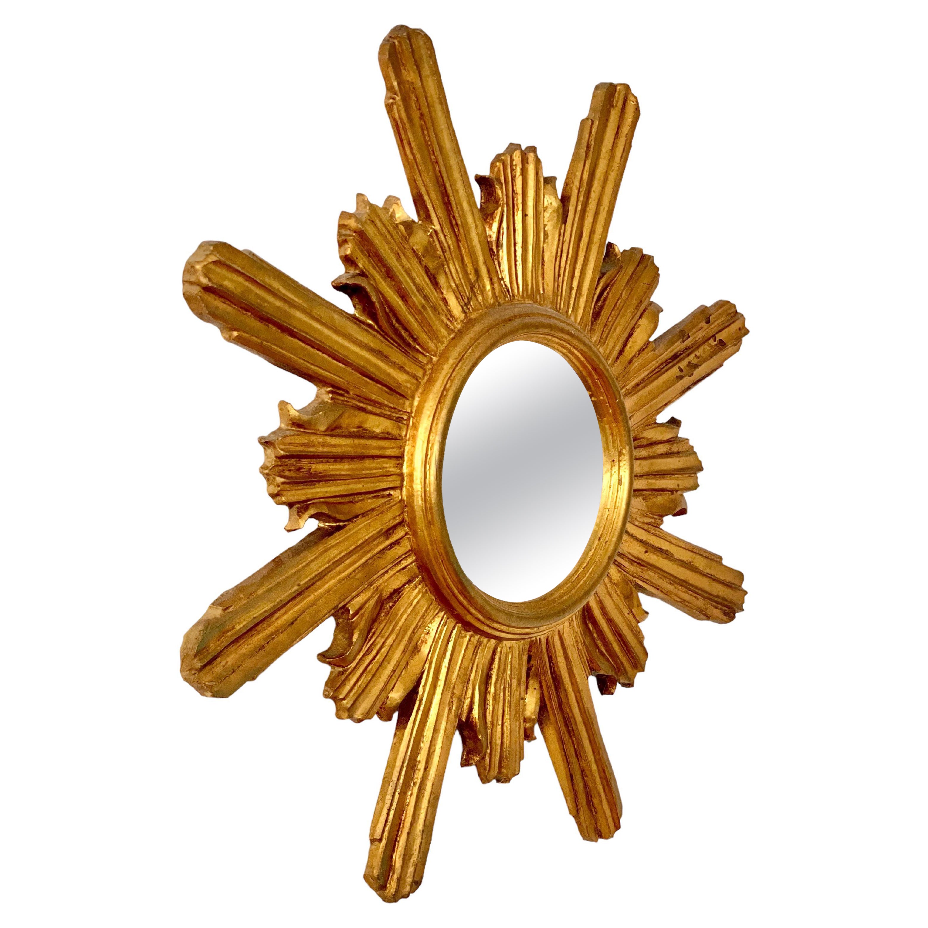 Sunburst-Spiegel aus geschnitztem und vergoldetem Holz im Angebot