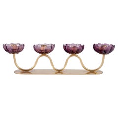 Vintage Gunnar Ander for Ystad Metall. Four-armed candle holder in brass and art glass.