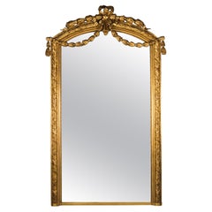 Grand miroir Napoléon III en bois doré et gesso sculpté
