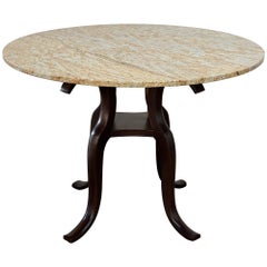 Table ronde avec base sculptée