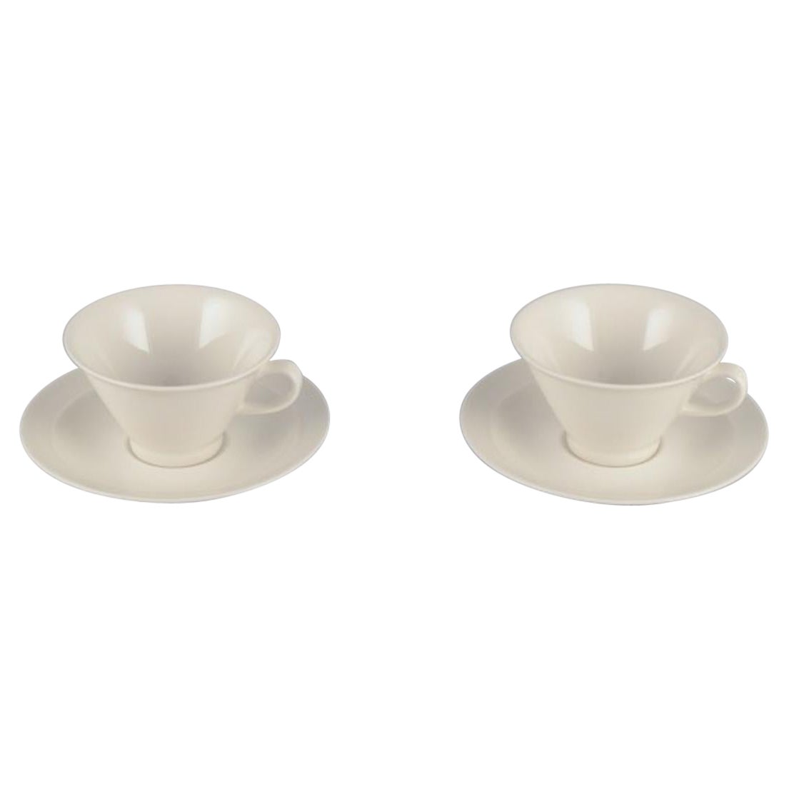 Arabia, Finland, Two sets of "Harlekin" tea cups and saucers in white porcelain. For Sale