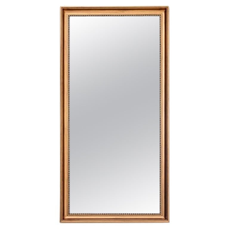 Mirror in a gold frame.