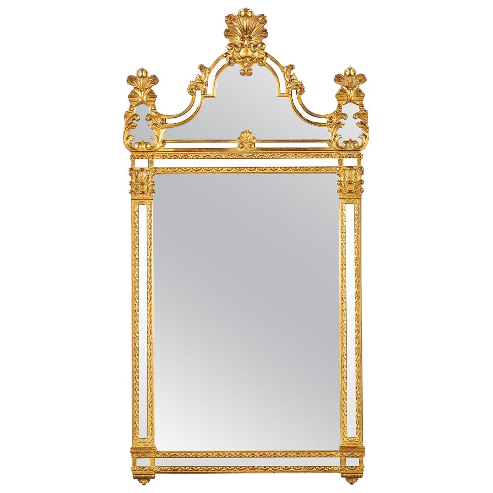 Grand et exquis miroir encadré doré de style Louis XVI par Deknudt en vente
