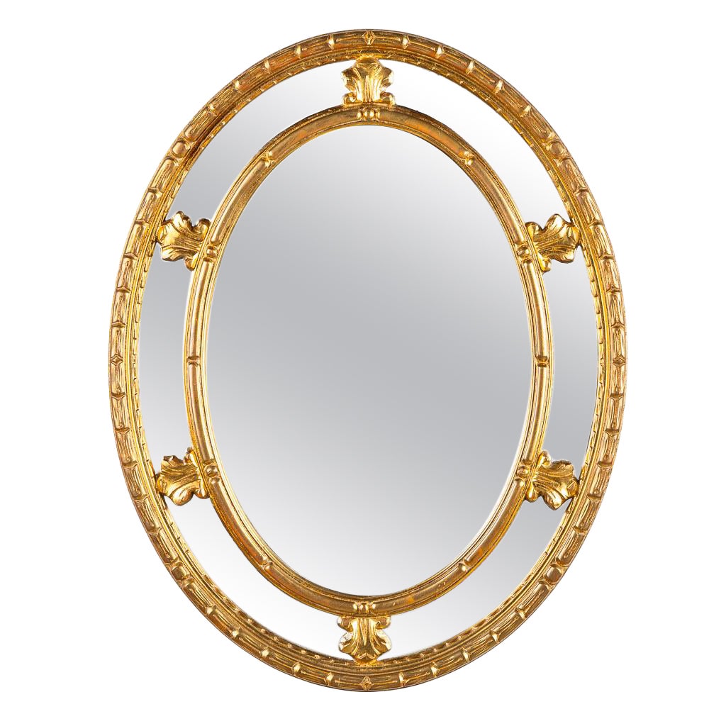 Grand miroir ovale vintage de style néoclassique avec cadre doré par Deknudt