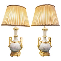 A fine pair of 19th century French celadon porcelain and gilt bronze lamps 