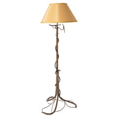 Stehlampe aus bronziertem Metall mit Baum und Schlange