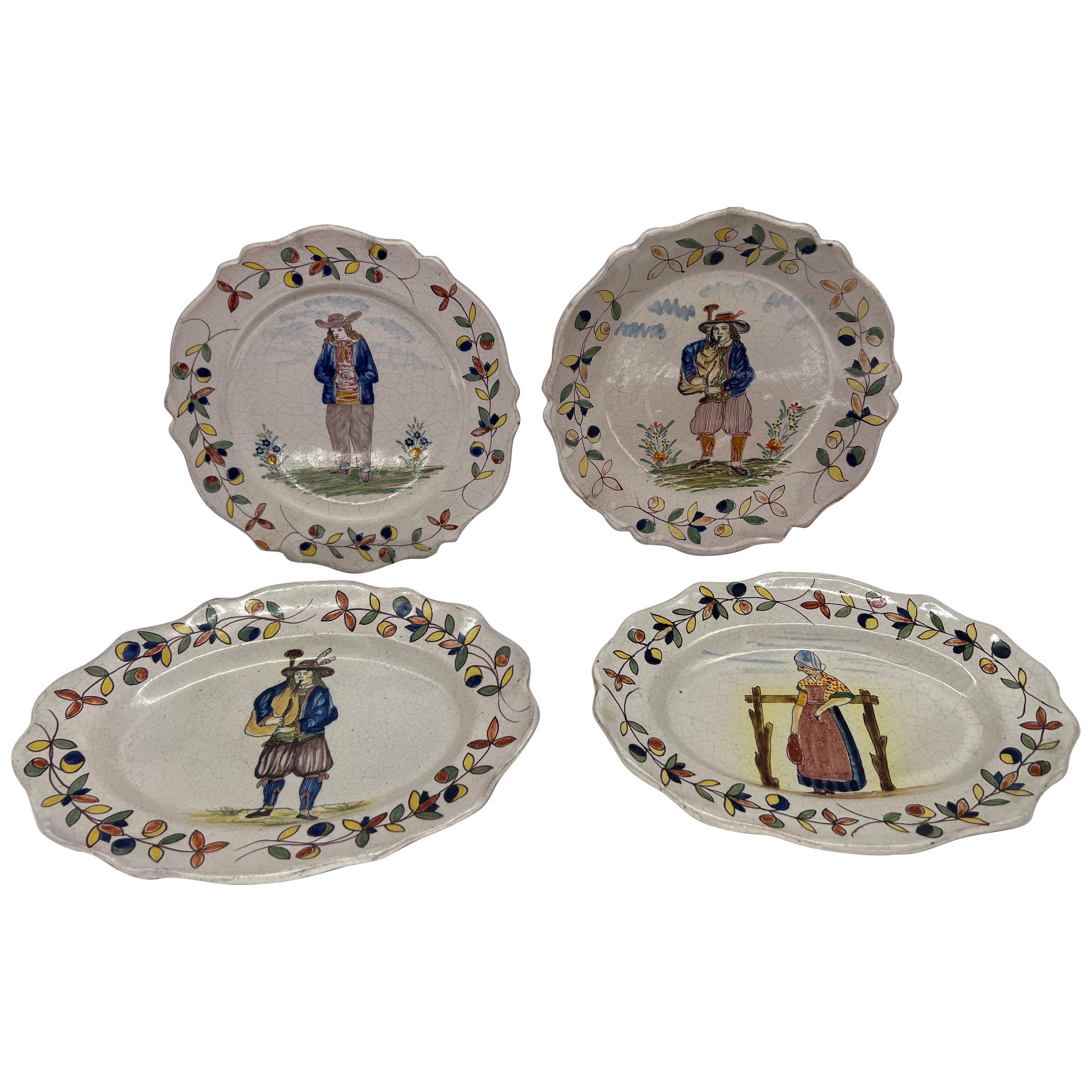 Colección de 4 platos figurados de cerámica francesa Quimper Faience Pottery