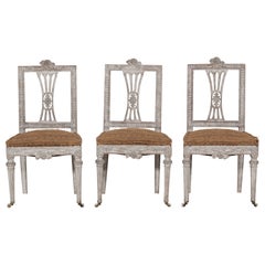 Antique Three richly carved Gustavian side chairs, 18th C.