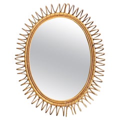 A large Italian 1970s bamboo oval mirror with spiral frame by Franco Albini