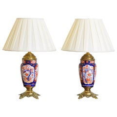 Pair of Japanese Imari Porcelain and Gilt Brass Table Lamps, early 20th C.