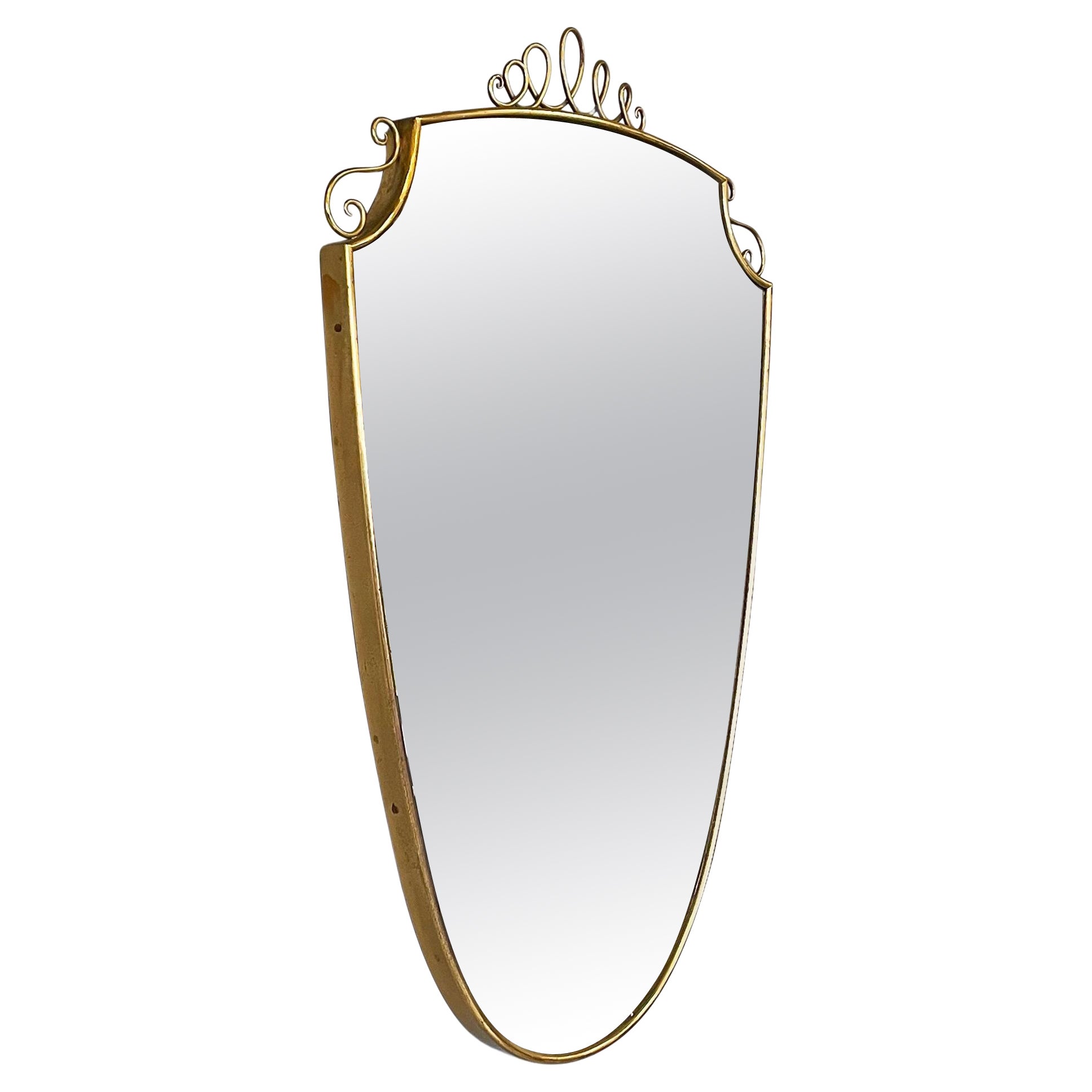 Italian mid-century modern Shield-shaped wall mirror with brass frame, 1950s