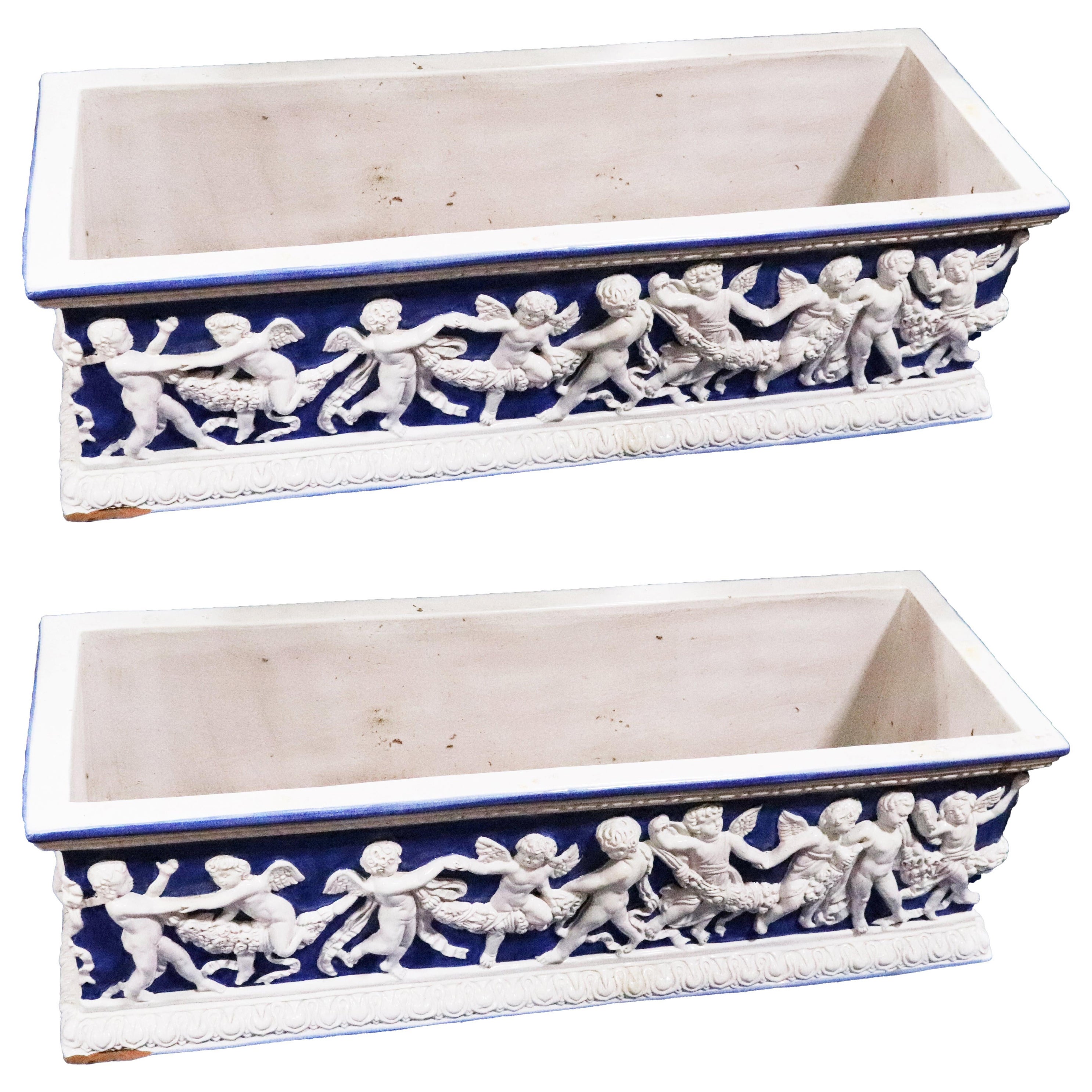 Pair of Large Antique Majolica Blue and White Planter Boxes with Putti For Sale
