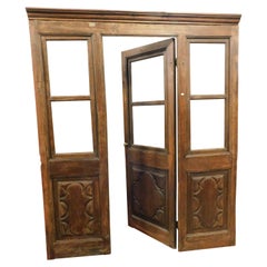 Vintage Glass entrance shop door with windows, carved walnut and complete frame, Italy