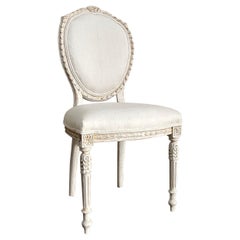Vintage armless carved chair