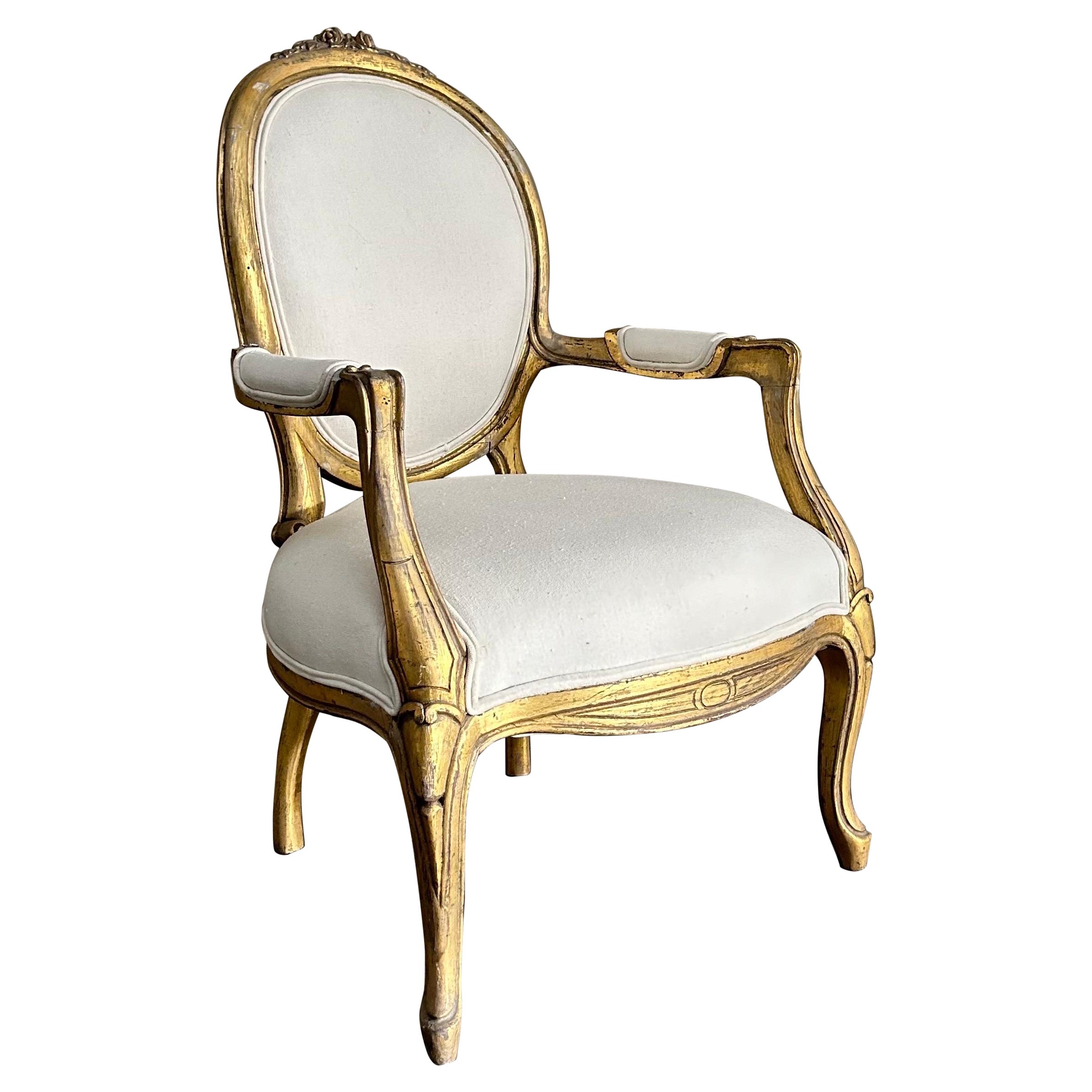 Vintage Louis XV style open arm giltwood chair For Sale