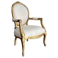 Used Louis XV style open arm giltwood chair