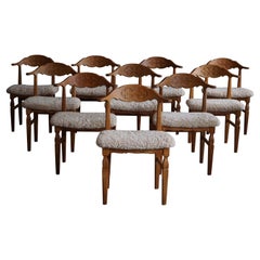 Henning Kjærnulf, ensemble de 10 chaises de salle à manger, retapissées en laine d'agneau, années 1960