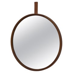 Round teak and leather wall mirror by Uno & Östen Kristiansson.