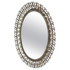 Retro Oval mirror, wrought iron. Spain 1970's Patinated in aged silver color.