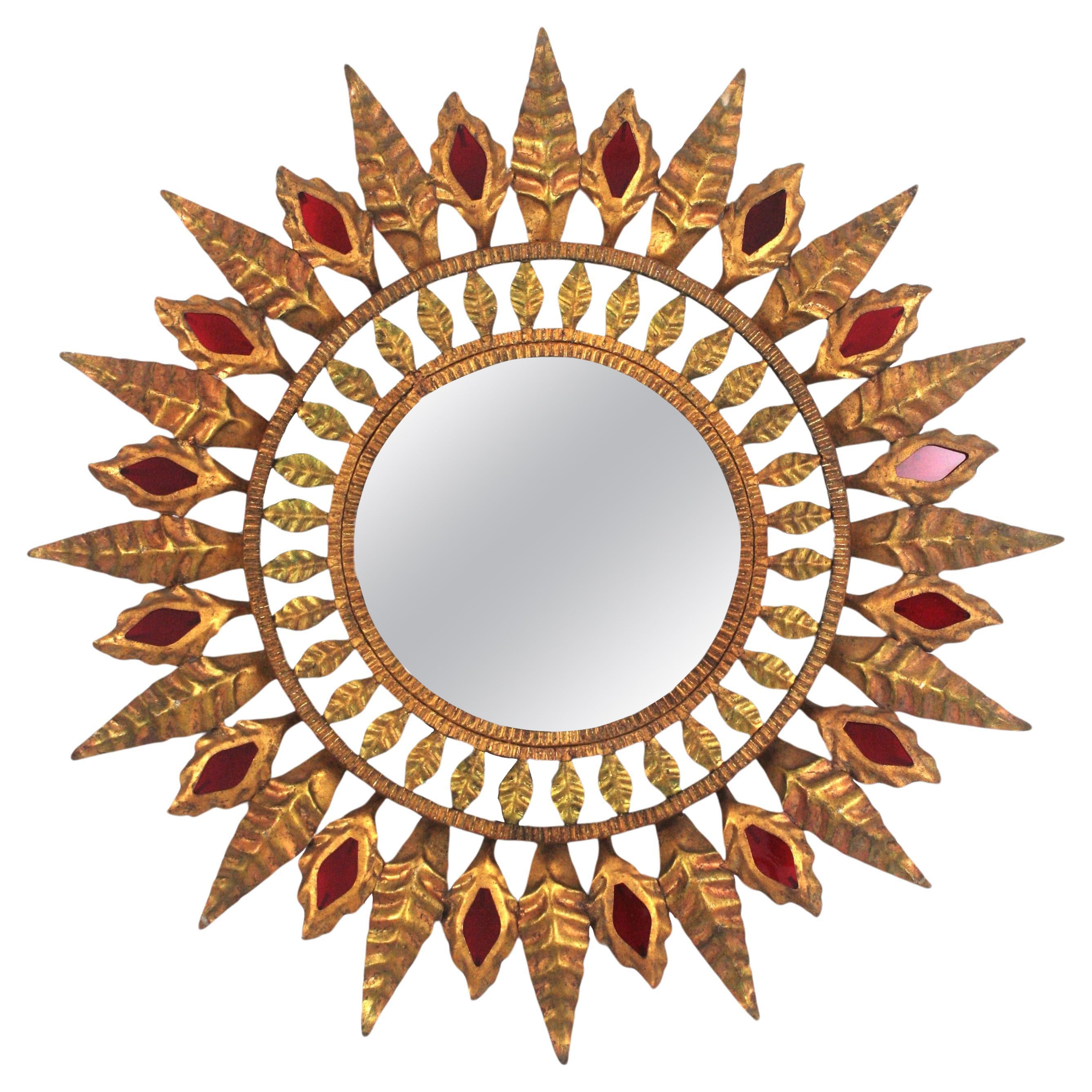 Hollywood Regency Sunburst Mirror in Gilt Metal and Red Glass Detail, 1950s
