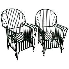 A Mid Century  Pair of Oversized Wrought Iron Patio Chairs