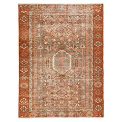 Antique Persian Heriz Wool Rug Featuring an Allover Motif In Rust